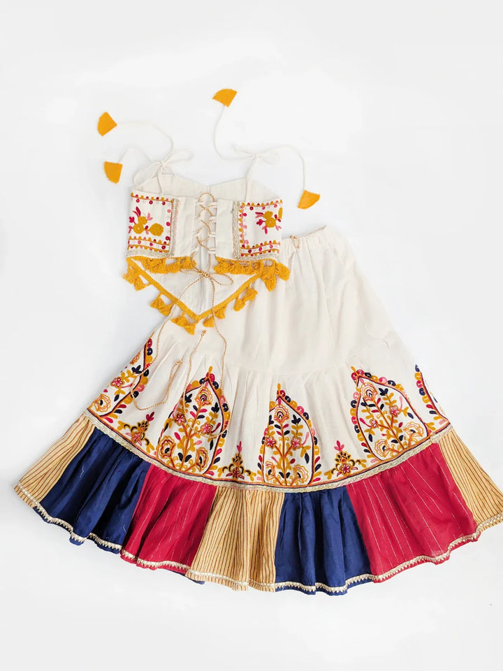 Colorful traditional dress with embroidery on a white background