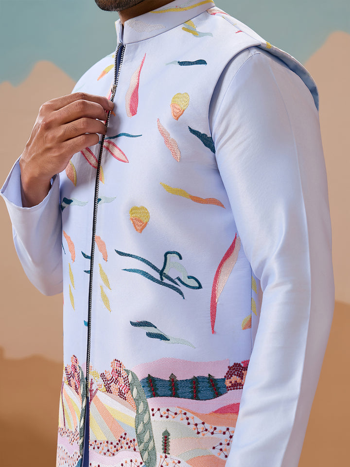 Person wearing a colorful patterned shirt with a neutral background