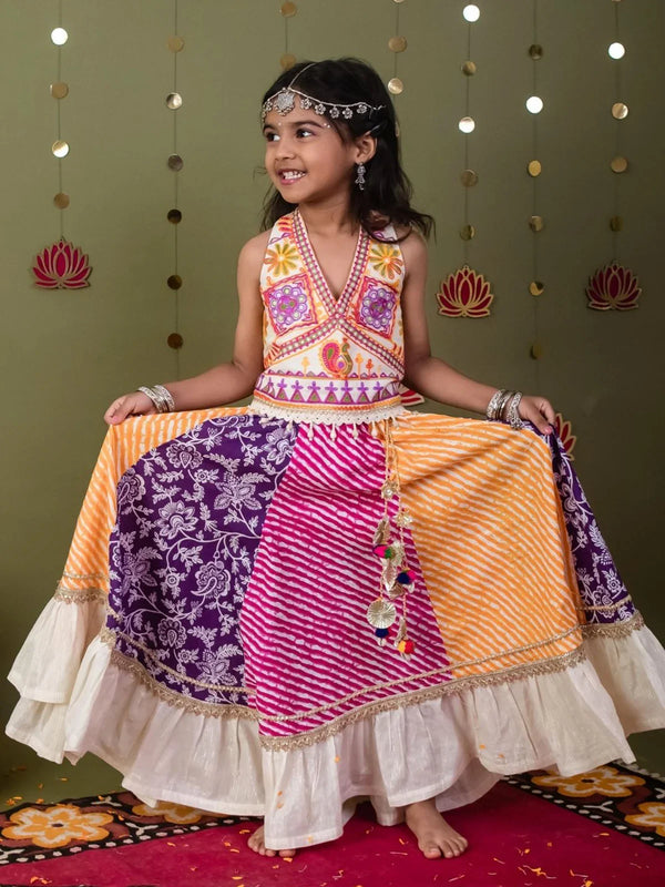 Girl wearing a multicolour lehriya bandhani Navratri lehenga choli with halter blouse