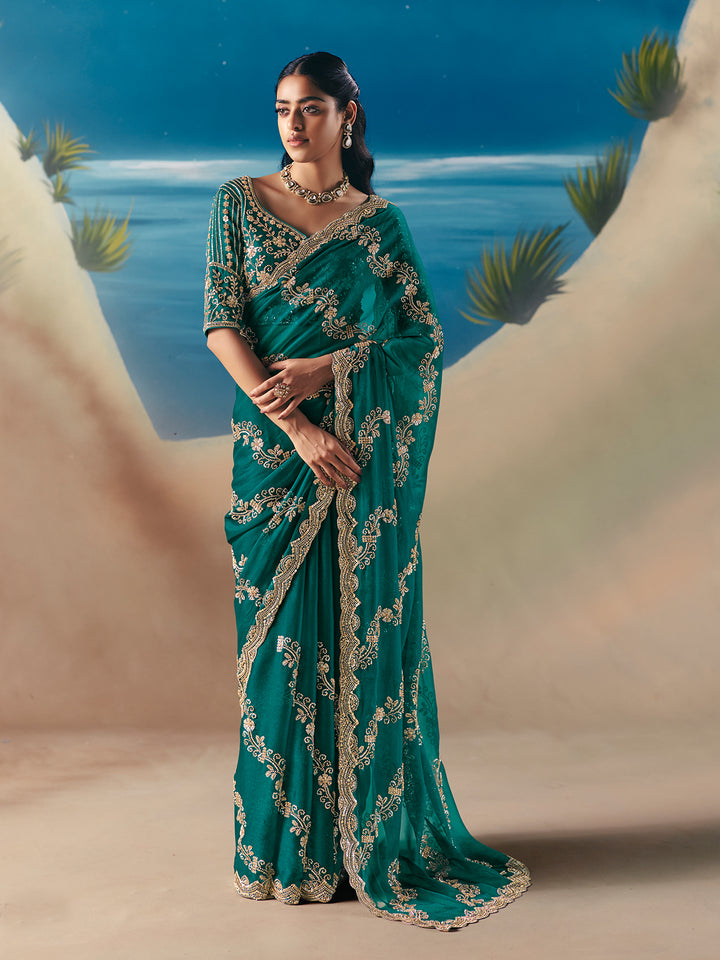 dark green satin organza saree with designer embroidery and sequins