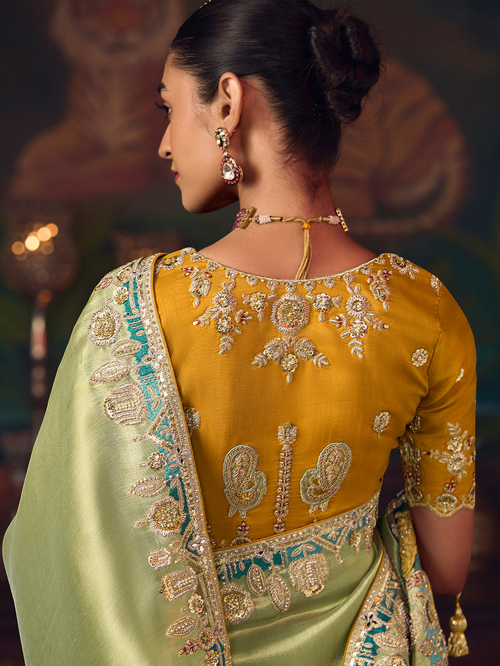 Woman wearing a traditional embroidered saree with a blurred background