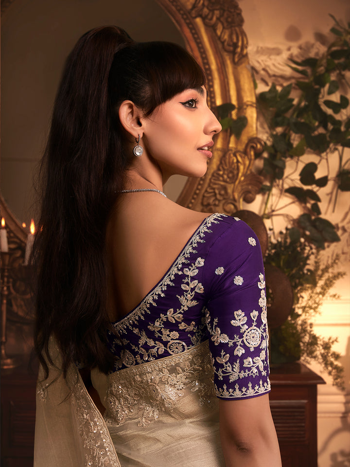 Beige Tissue Organza Saree with Heavy Embroidery & Stone Work Border – Party & Wedding Wear with Purple Silk Blouse