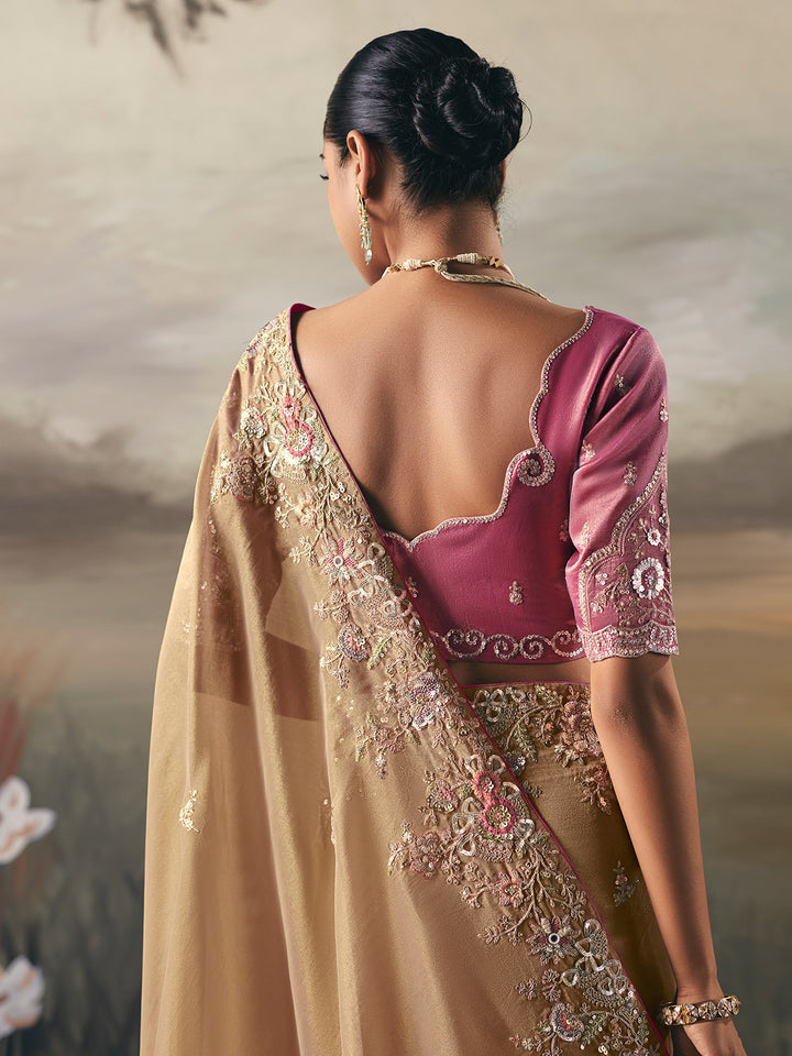 Woman wearing a traditional saree with a blurred background
