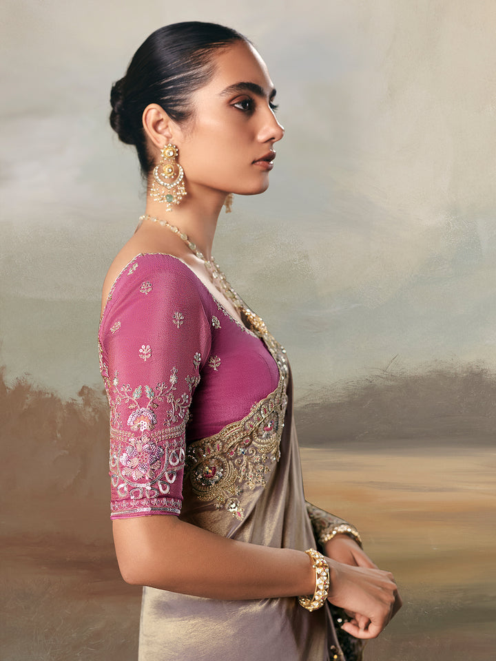 Woman wearing a traditional saree with a blurred background