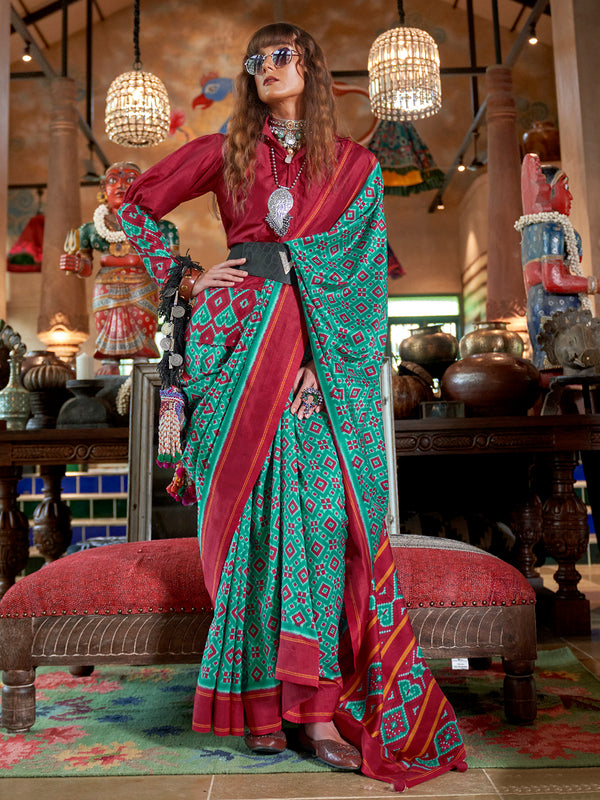 Woman in a vibrant saree with a colorful background