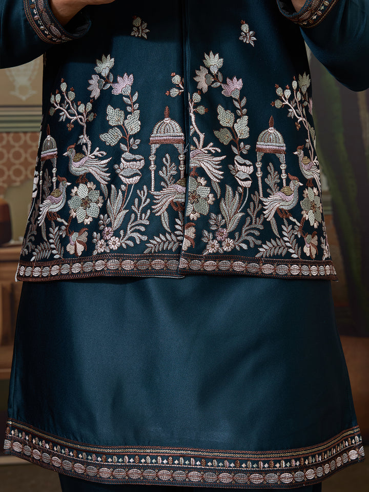 Traditional embroidered garment with intricate designs on a dark blue fabric.