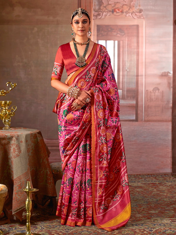 Woman in a vibrant saree with a traditional setting