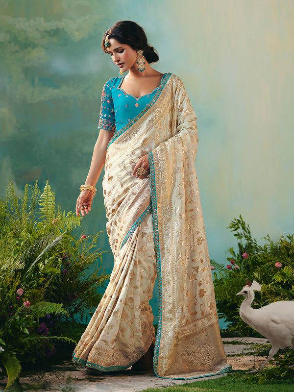 Off-White Dola Silk Saree with Blue Designer Blouse for Festive Occasions