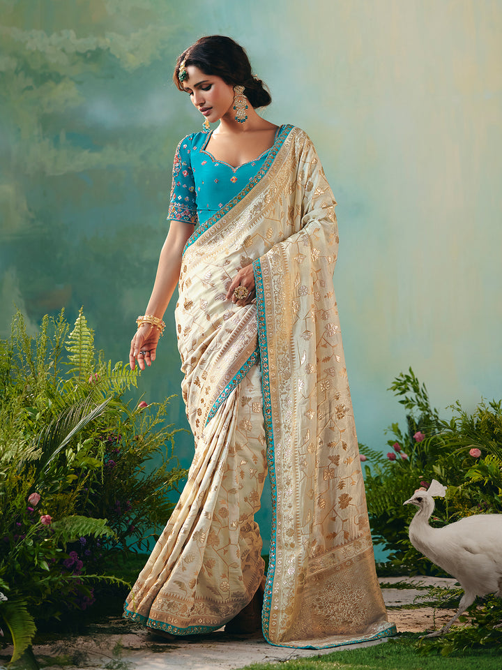 Off-White Dola Silk Saree with Blue Designer Blouse for Festive Occasions