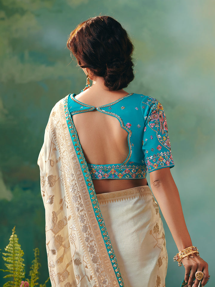 Off-White Dola Silk Saree with Blue Designer Blouse for Festive Occasions