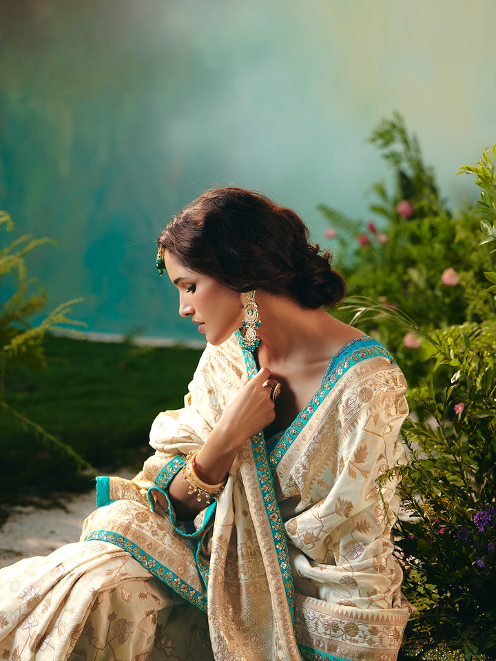 Off-White Dola Silk Saree with Blue Designer Blouse for Festive Occasions