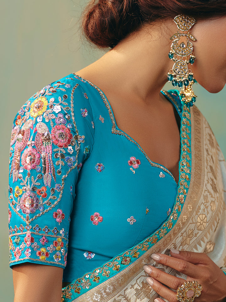 Off-White Dola Silk Saree with Blue Designer Blouse for Festive Occasions