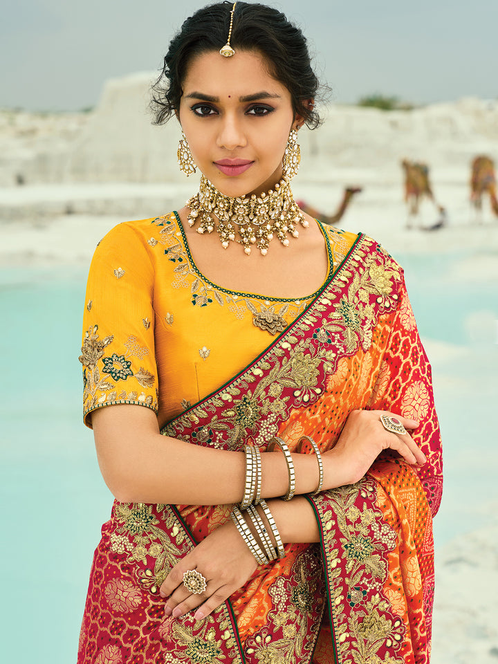 Designer Georgette Bandhej Saree with Moti & Cut-Dana Hand Work Border in Red, Mustard & Orange | Yellow Blouse Included – Occasion Wear Saree
