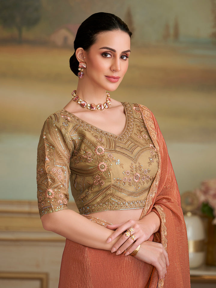 Woman wearing a traditional outfit with intricate designs in a warm-toned setting