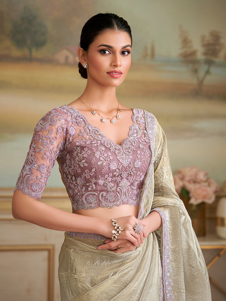 Woman wearing a traditional saree with a scenic background