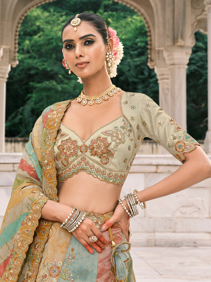 Woman in traditional Indian attire with jewelry, standing in front of an architectural background.