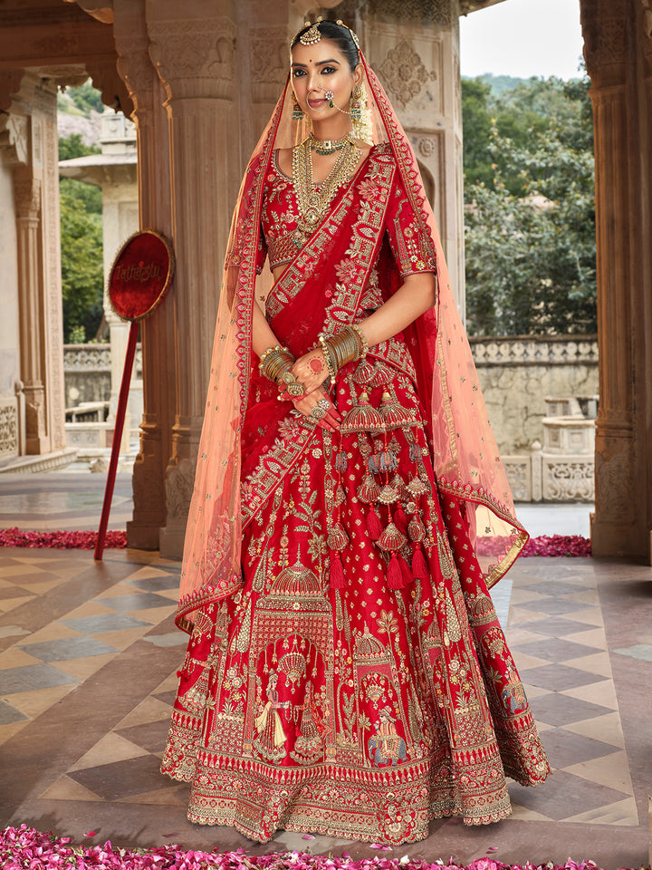 Woman in a traditional red and gold embroidered outfit standing in an ornate setting.