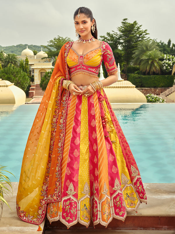 Woman in a traditional yellow and pink outfit by a pool with a scenic background