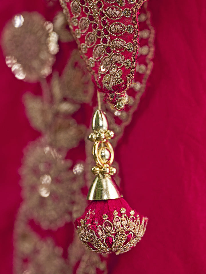 Decorative red and gold tassel against a red background