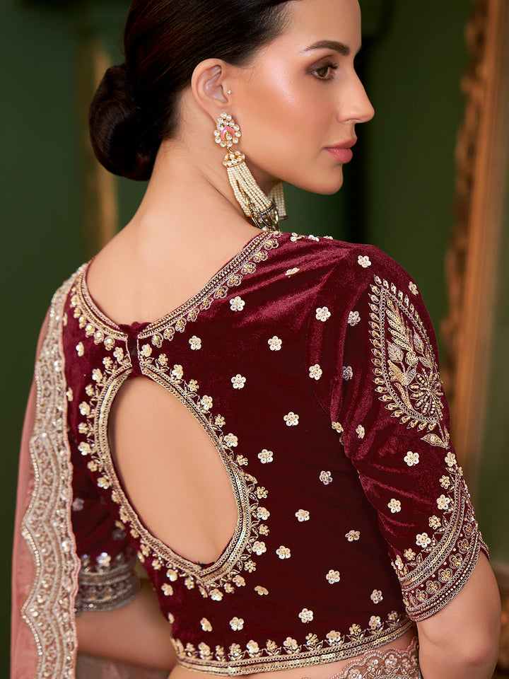 Maroon velvet blouse with gold embroidery on a blurred background