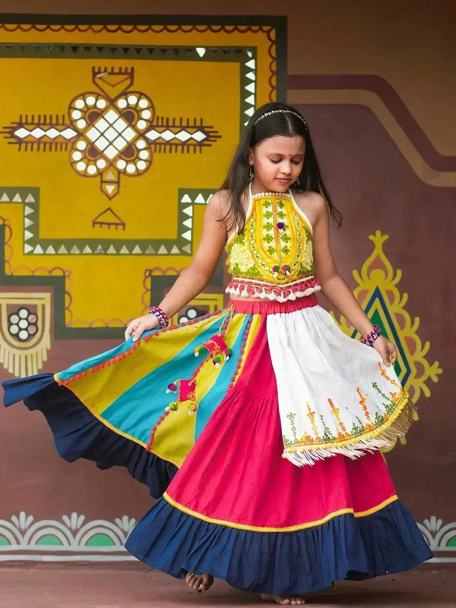 Girl in a lime yellow Ghoomar style Navratri chaniya choli from the VJV Now girls kids traditional collection
